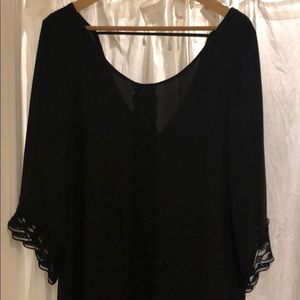 beautiful, black dressy top/dress. lace detail.
